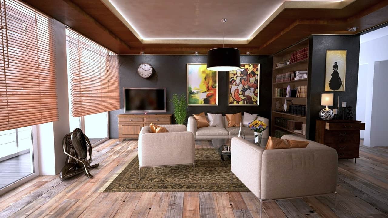 Indoor wooden blinds in modern loungeroom with yellow and orange artworks and cream sofas